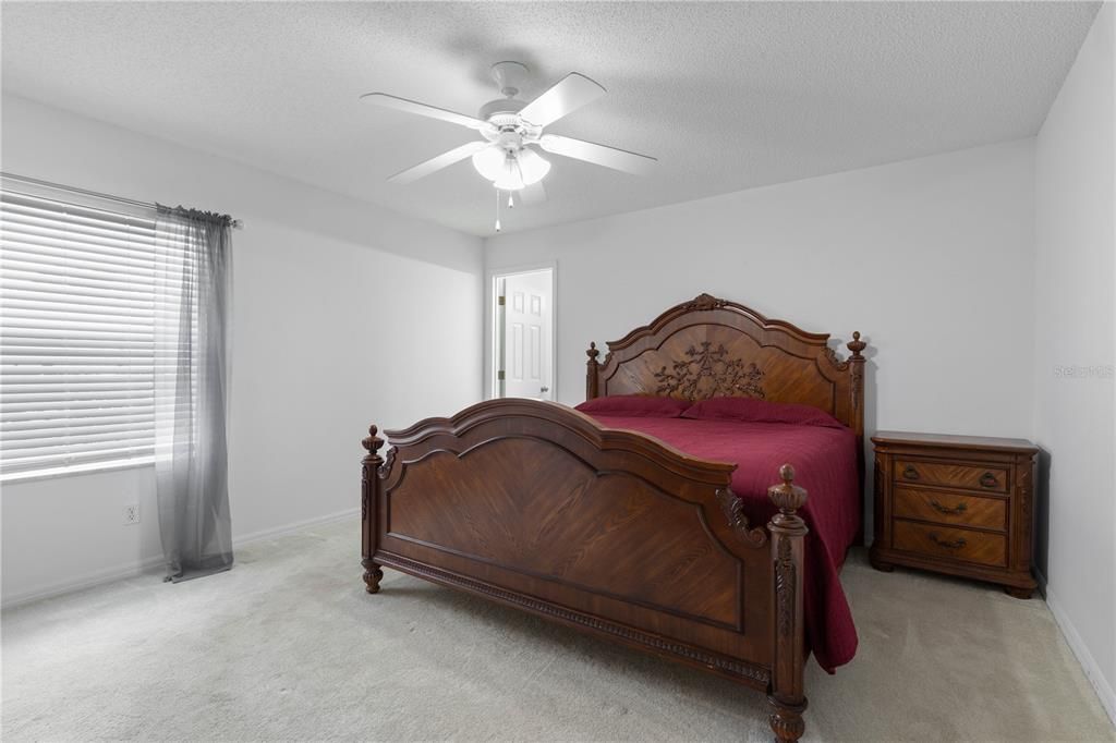 Primary Bedroom with Window View and King Size Bed