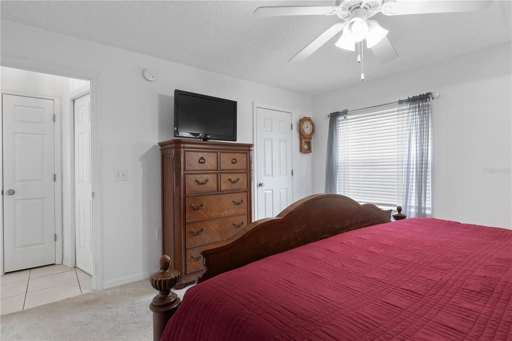 Primary Bedroom with Window View and Dresser