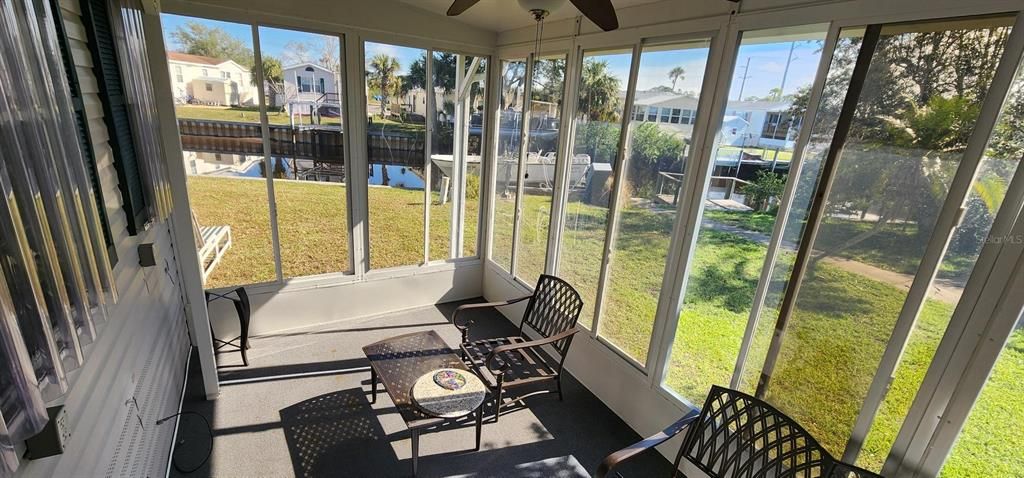 Awesome views from your enclosed lanai...has sliding windows to enjoy the fresh breeze off the water....