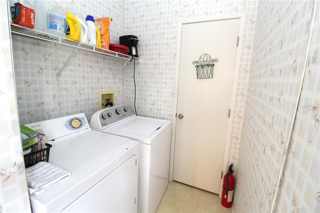 Laundry room with pantry/storage closet