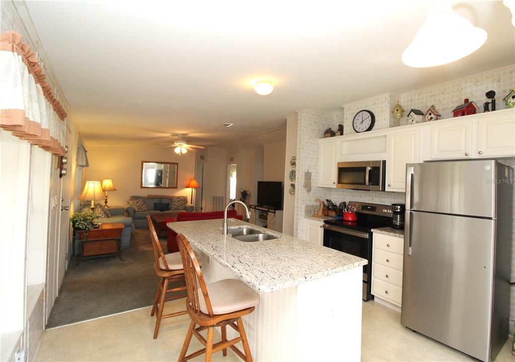 Kitchen has plenty of cabinets for storage....