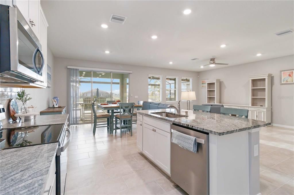 Upgraded stainless steel appliances, granite countertops and a large island.