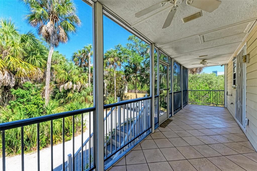 screened patio entrance to elevated first & second floors