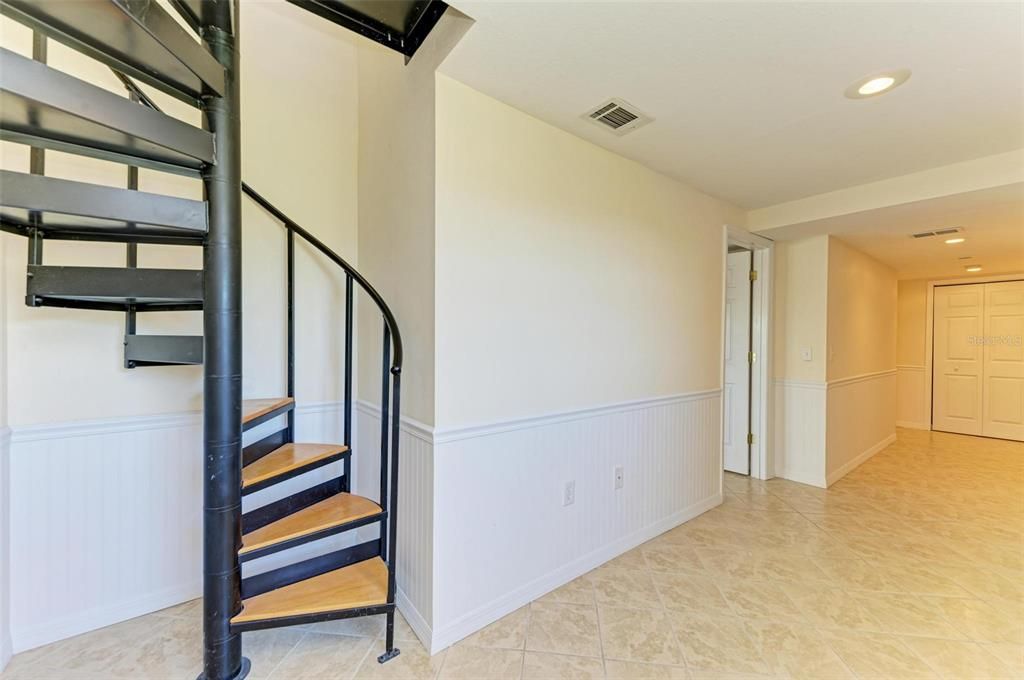 Spiral staircase leading to second floor main living