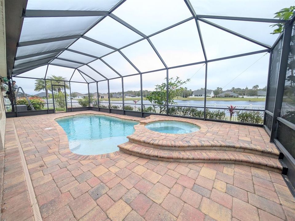 Paver patio with two screen doors on either side