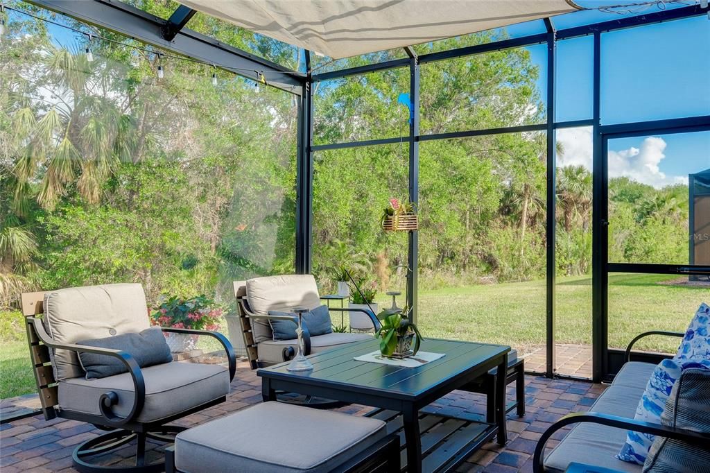 Extended Lanai with pavers and nature view