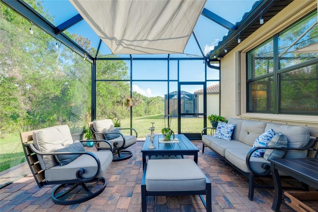 Extended Lanai with pavers and nature view