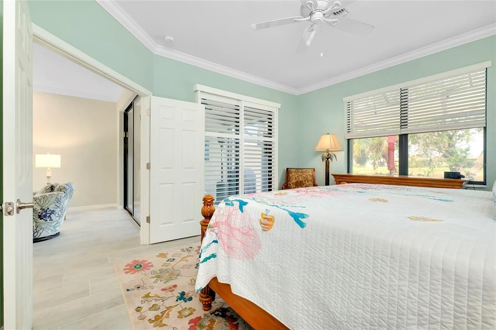 Primary Bedroom w/tile flooring w/Lanai Access