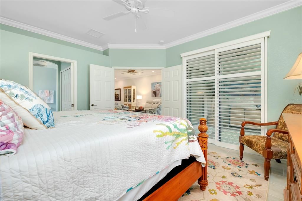 Primary Bedroom w/tile flooring w/Lanai Access