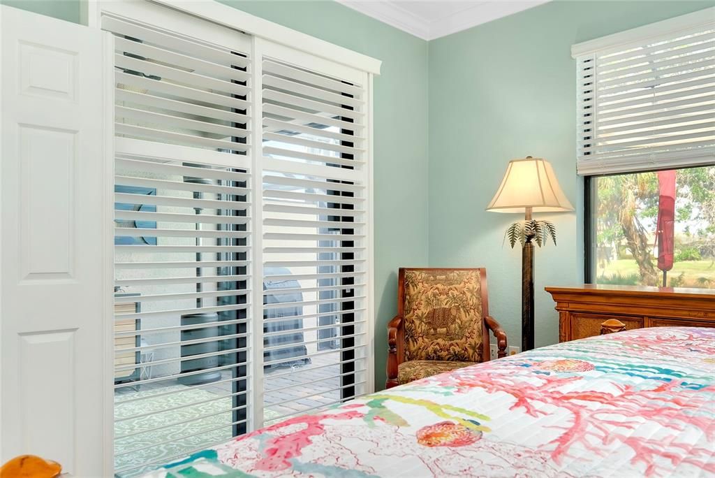 Primary Bedroom w/tile flooring w/Lanai Access