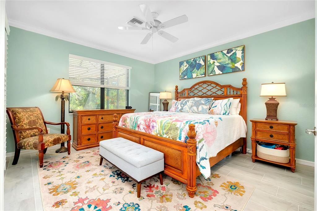 Primary Bedroom w/tile flooring w/Lanai Access