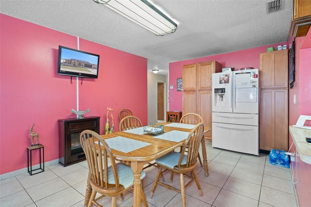 View 2 of the Formal Dining Room. The additional Refrigerator does stay with the Home