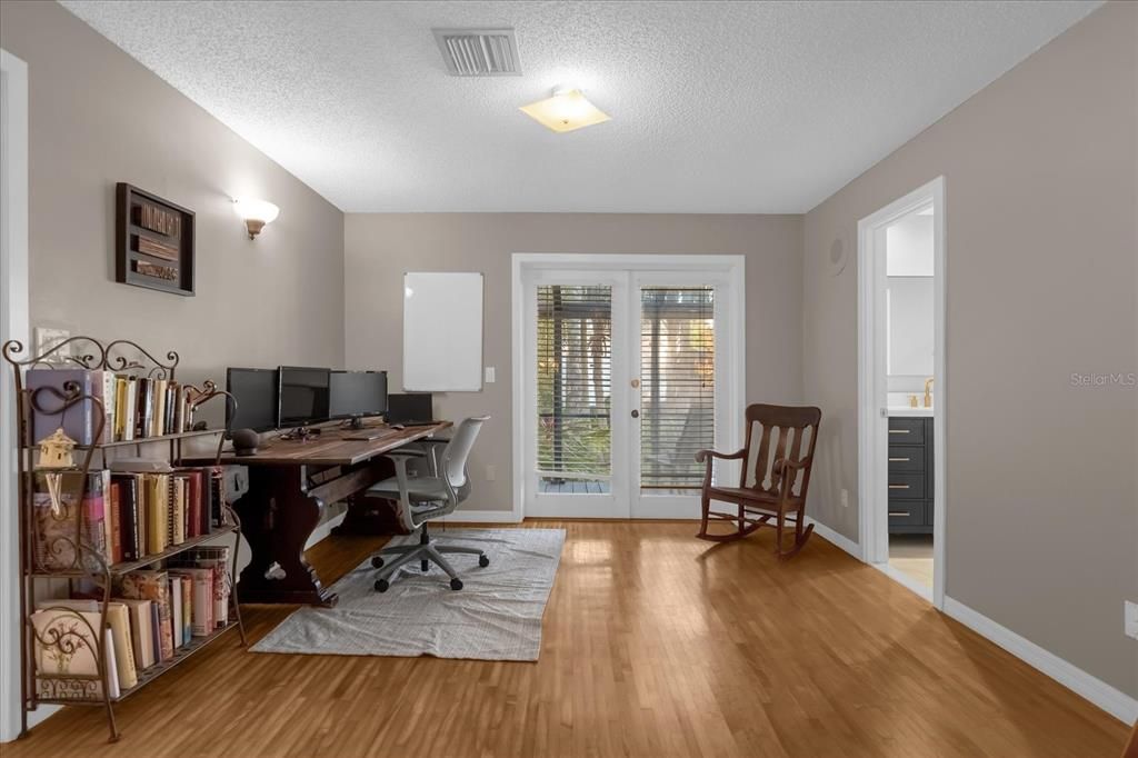 Screened in patio with built in desk off of the Office