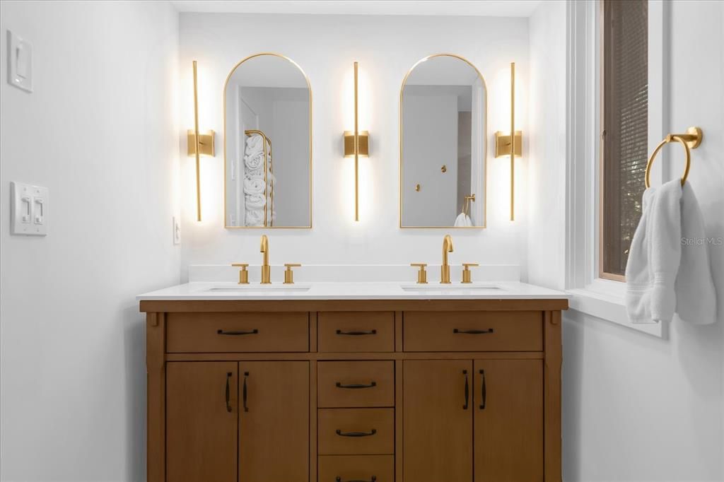 Primary Bathroom with custom built in medicine cabinets behind the mirrors for additional storage