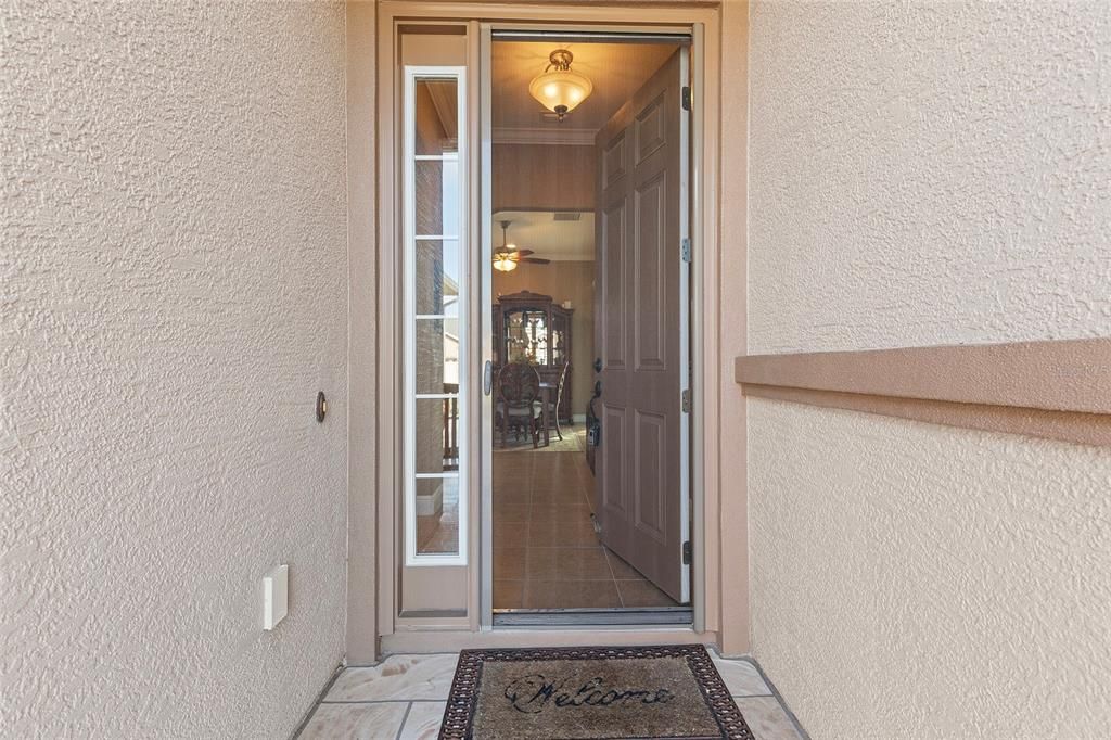 8' Front entrance with sliding screen door and sidelite