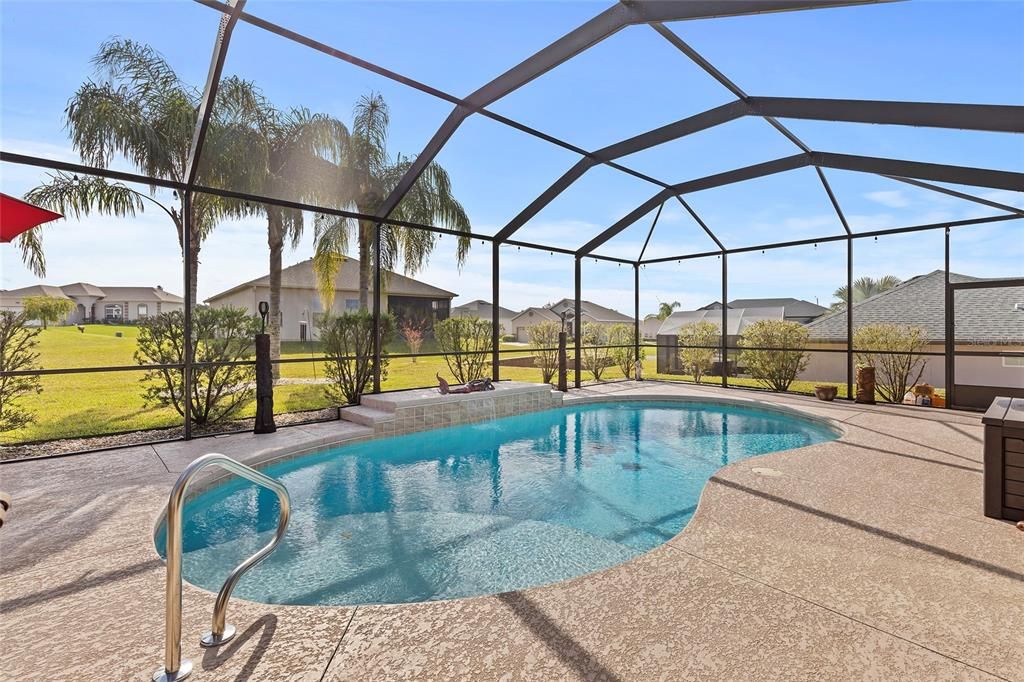 Soaking ledge in pool, waterfall