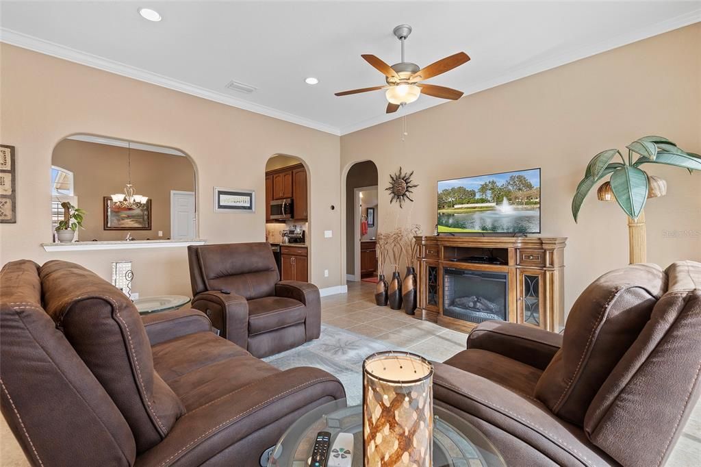 Living room looking toward kitchen, arched doorway to right lead to guest bath and two guest bedrooms