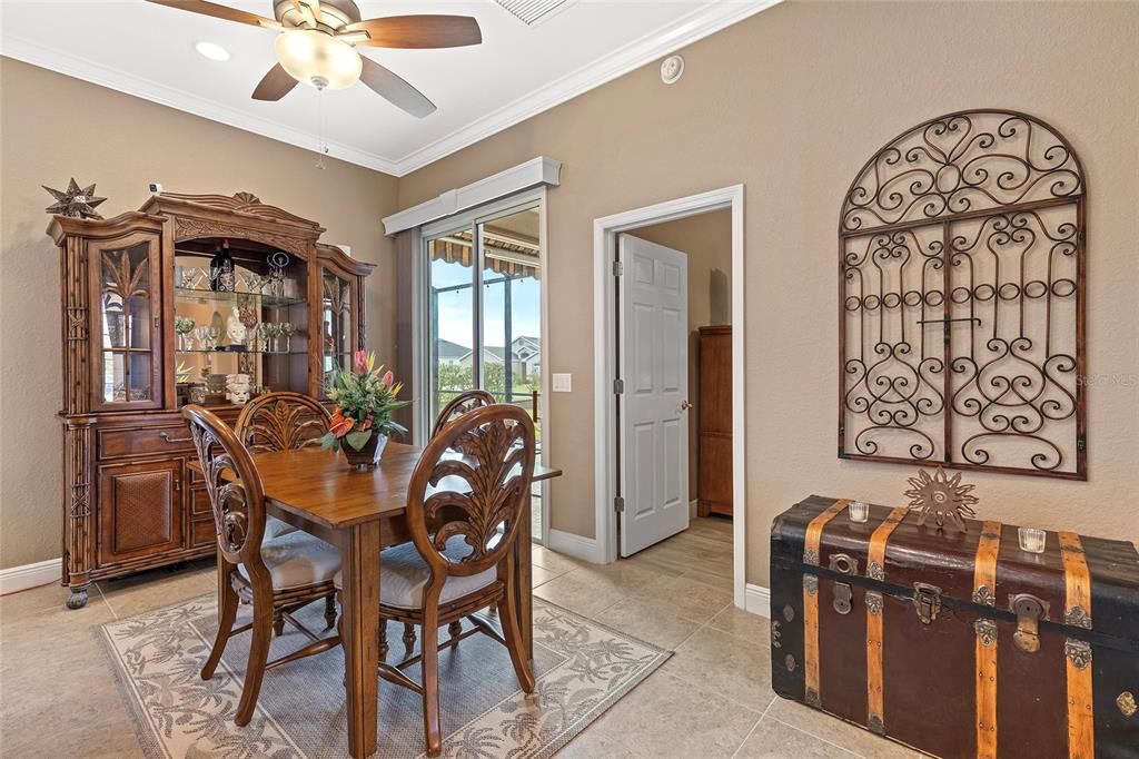 Dining area, sliding door to lanai, door to right leads to primary suite