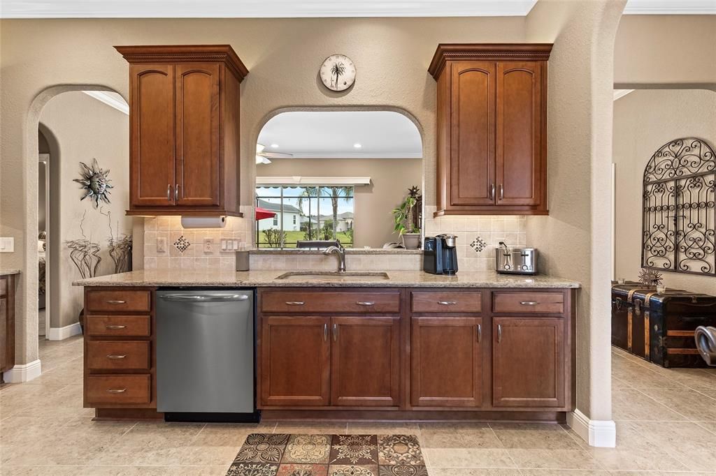 42" cabinets in kitchen, over and under cabinet lighting, Quartz counter tops, designer backsplash