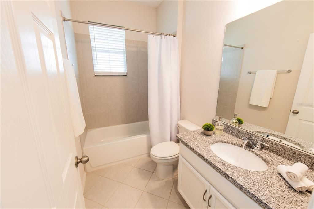 guest bath with granite countertops