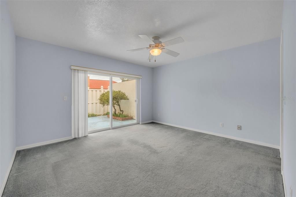 Primary bedroom with access to the back patio