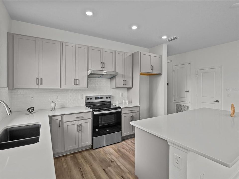 White tile backsplash in the kitchen