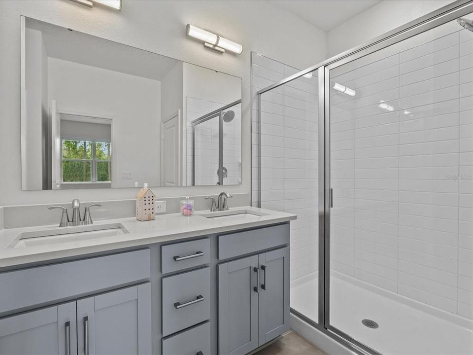 Main bedroom - shower, dual sink, cabinets with drawers and quartz counter tops