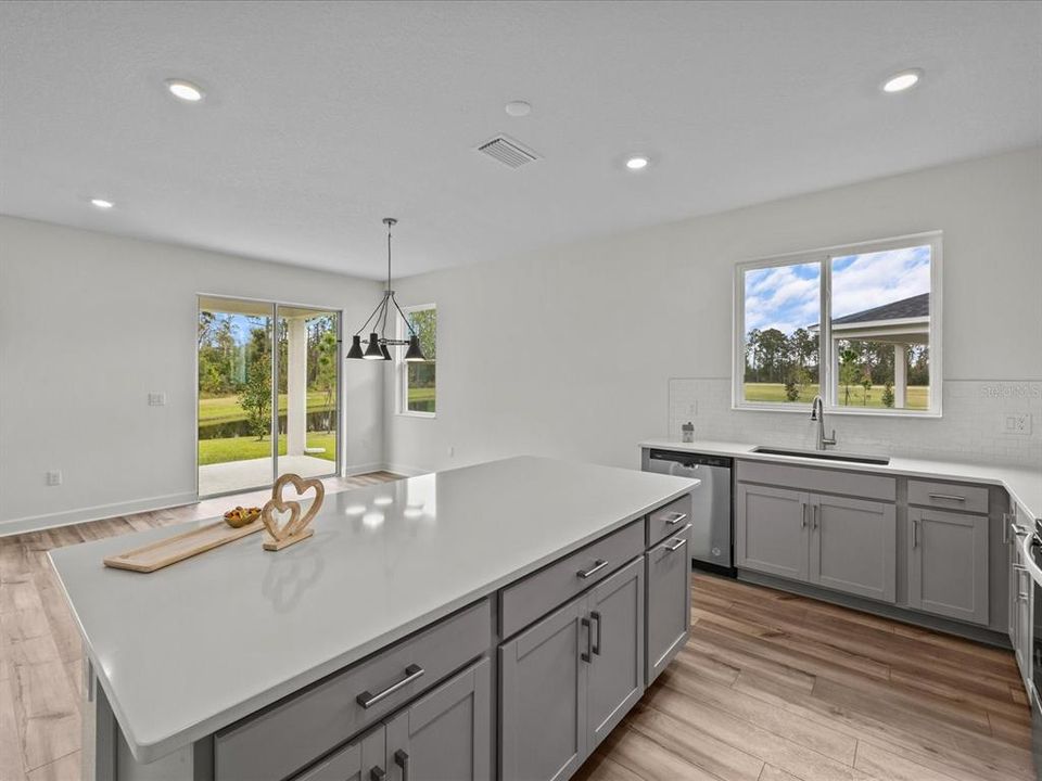 View from the kitchen to the dining room and sliding door to the covered lanai