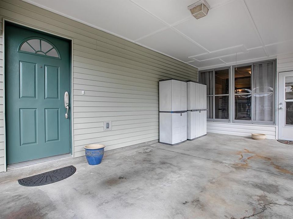 COVERED CARPORT WITH PLENTY OF ROOM FOR PARKING