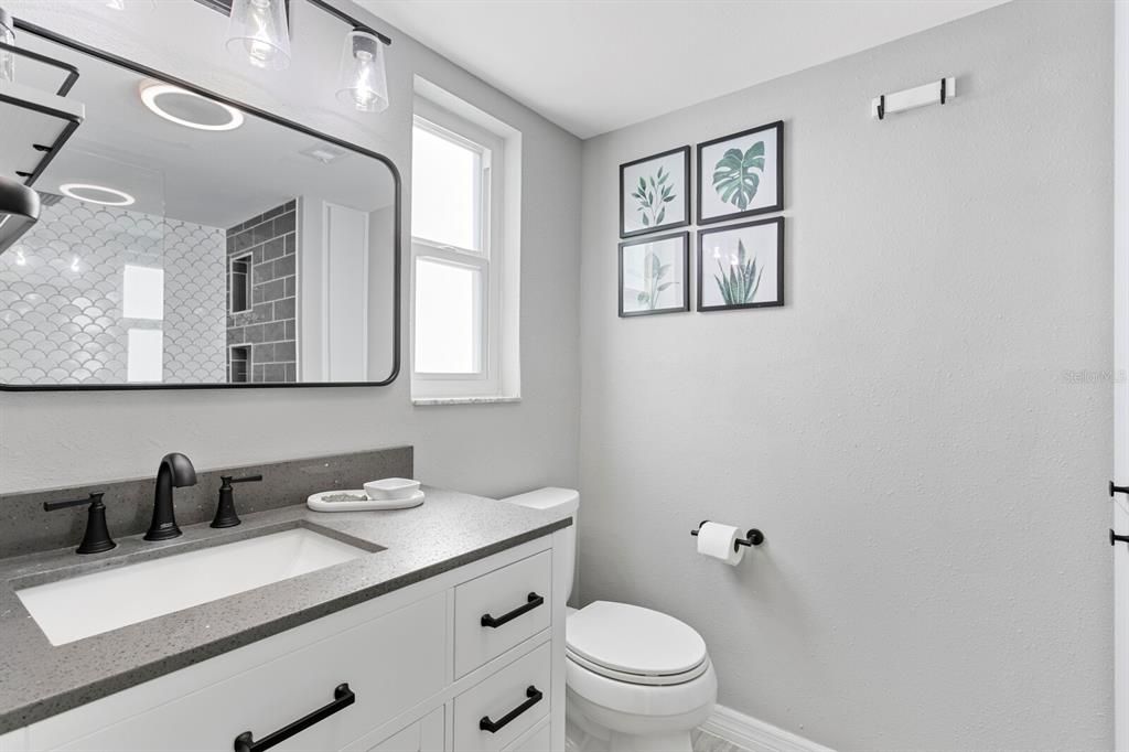 Gorgeous, new primary bath with quartz counters