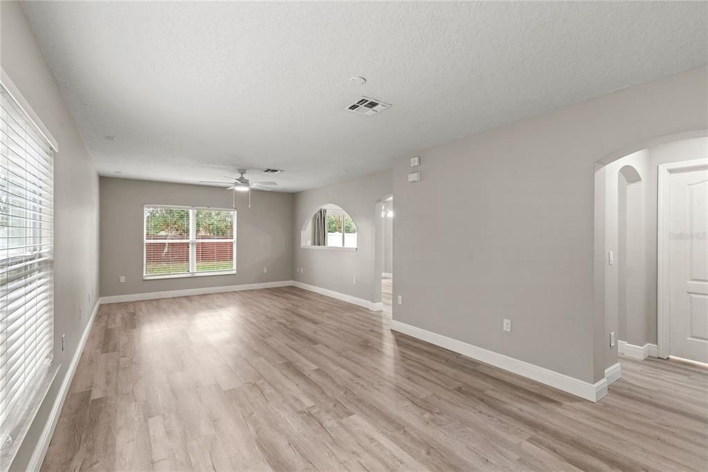 Spacious living room/dining room combo with luxury vinyl flooring