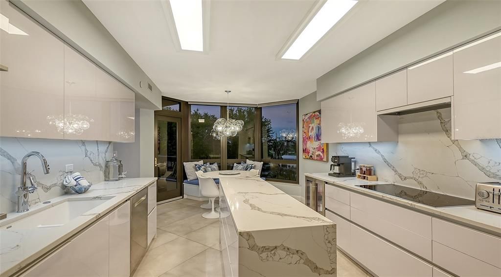 The tile backsplash & soft smooth surfaces bounce the great light throughout the space