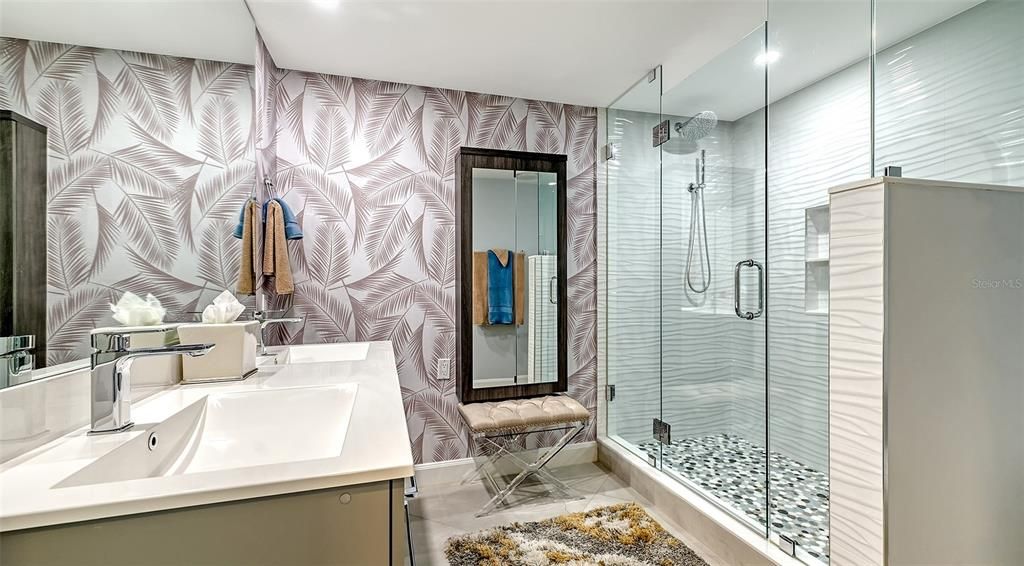 Exquisitely updated guest bath with a custom  built-in make up vanity