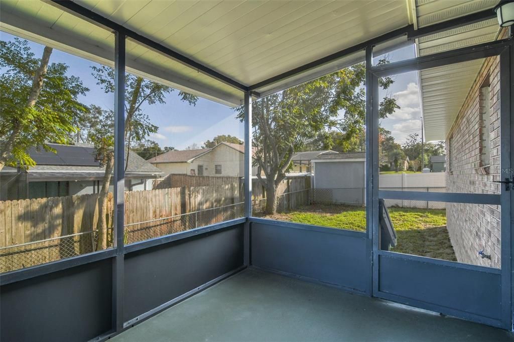 Back patio and fenced yard