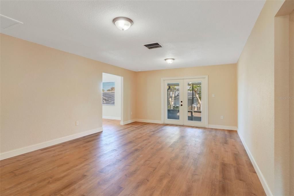 Oversized family room with french doors to screened back patio