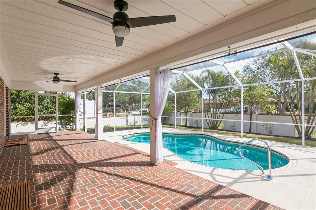 Covered lanai area of pool.