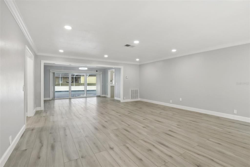 Living Room features Recessed lighting Cron molding and 5" Base Boards.