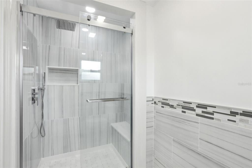 Primary Bath Shower with Bench and custom tile.