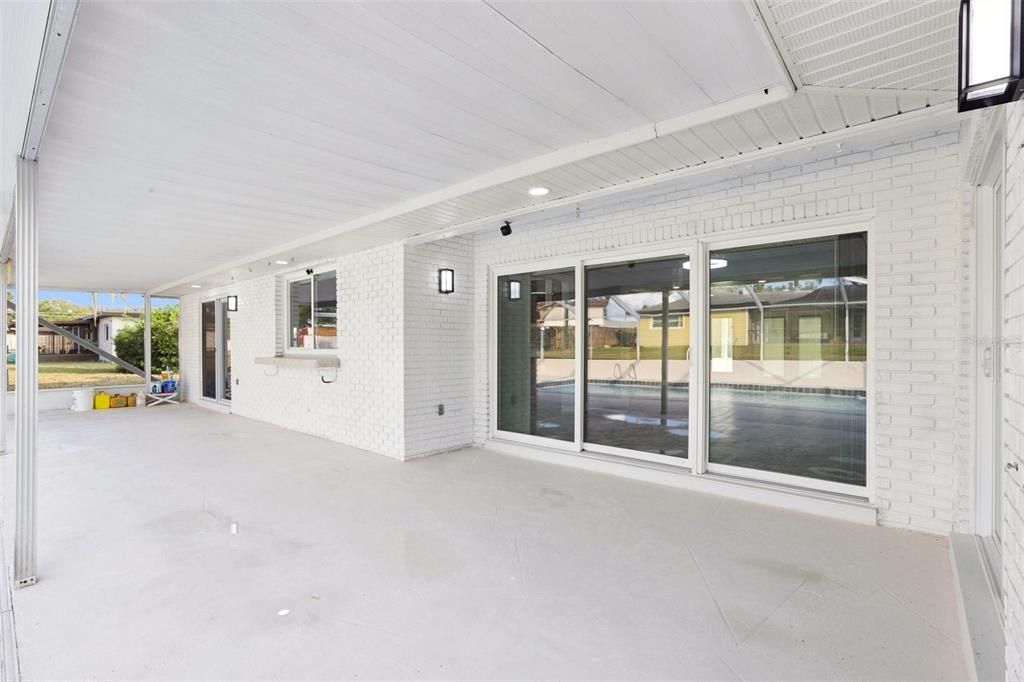 Family Room Slider, Service Counter at Kitchen Window and Dining Room Triple Slider.