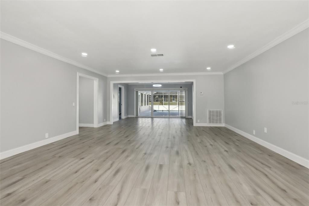 Living Room with long view to pool.