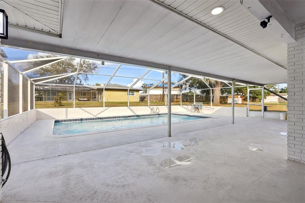 Covered Lanai has ample room for both seating and dining areas!