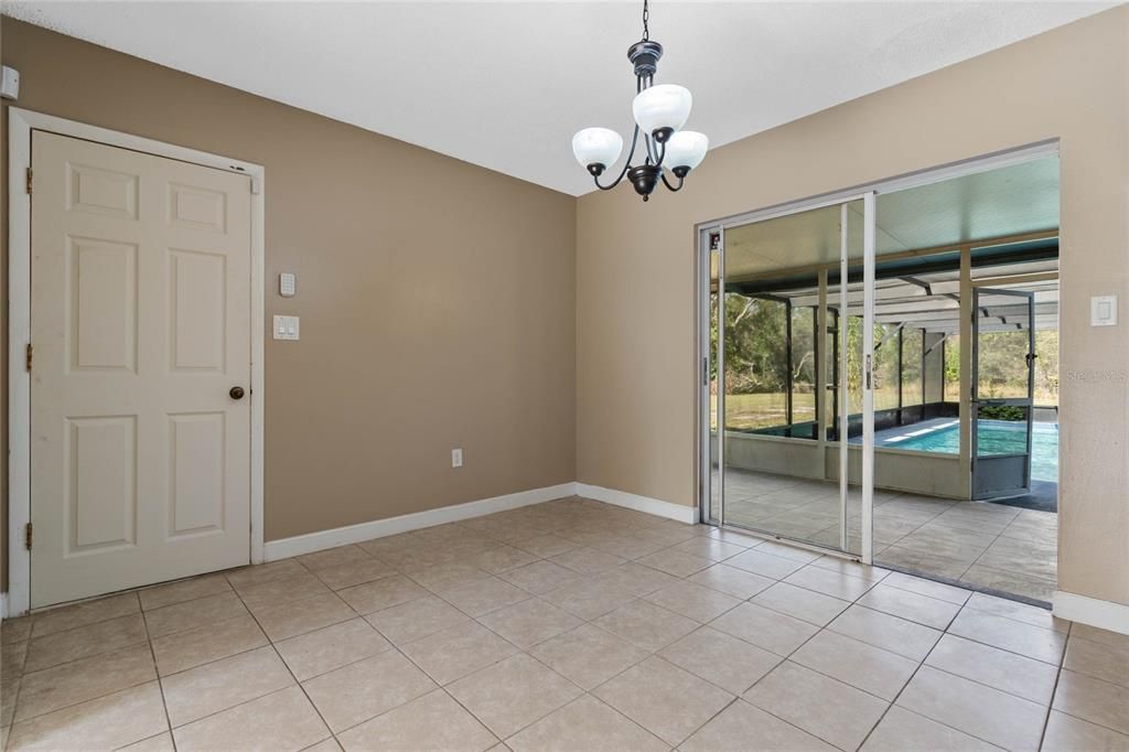 Dining room looking out to the back patio and pool.