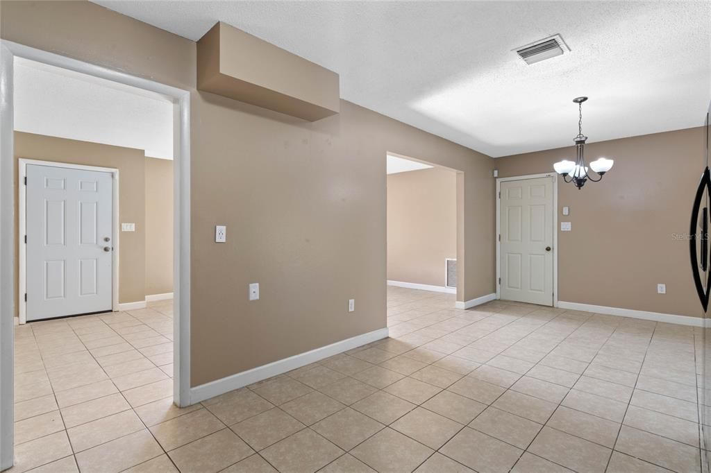 Kitchen with dining room to the right.