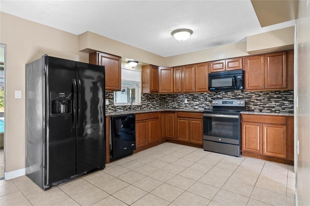 Kitchen with granite counters and eat-in space