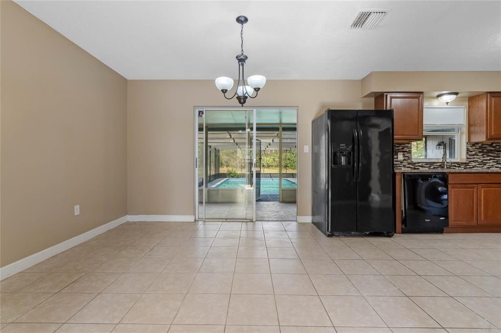 Dining room looking out to the back patio and pool.