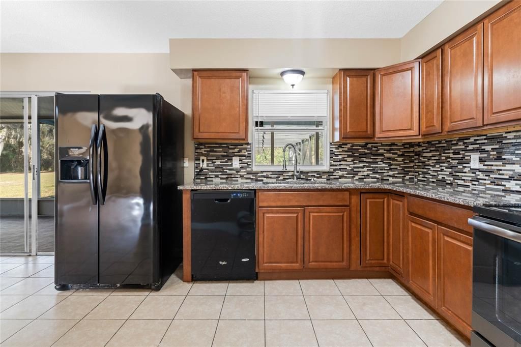 Kitchen with granite counters and eat-in space