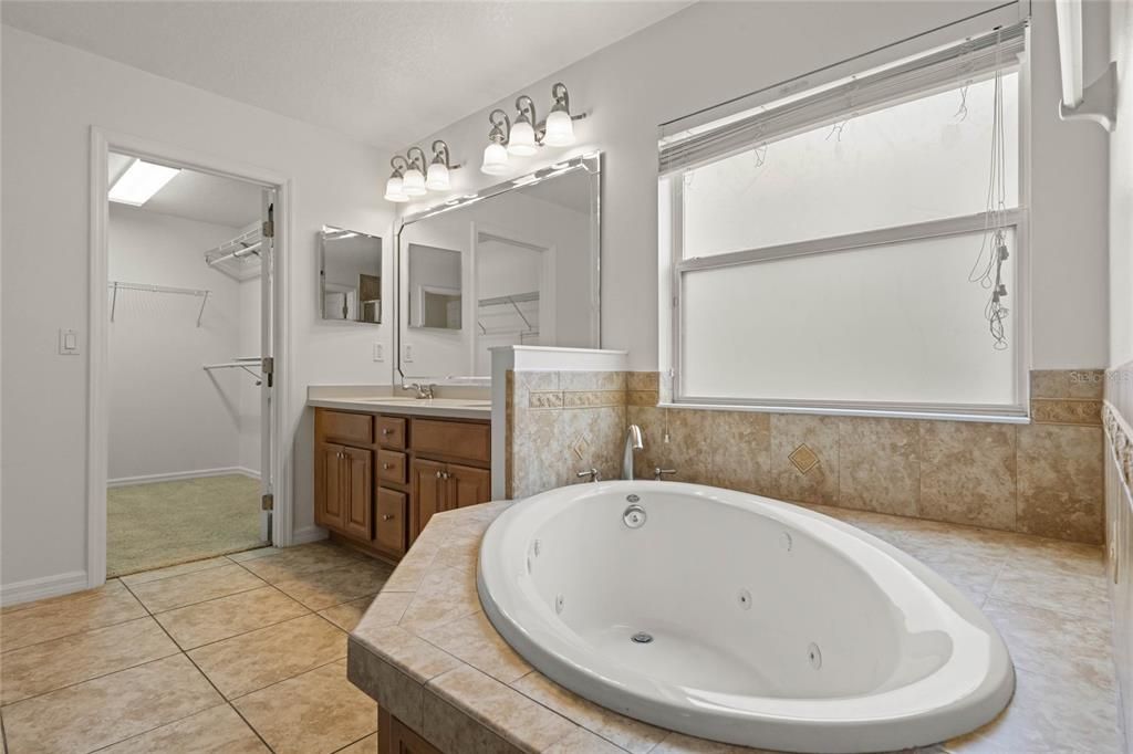 primary bathroom with jetted tub