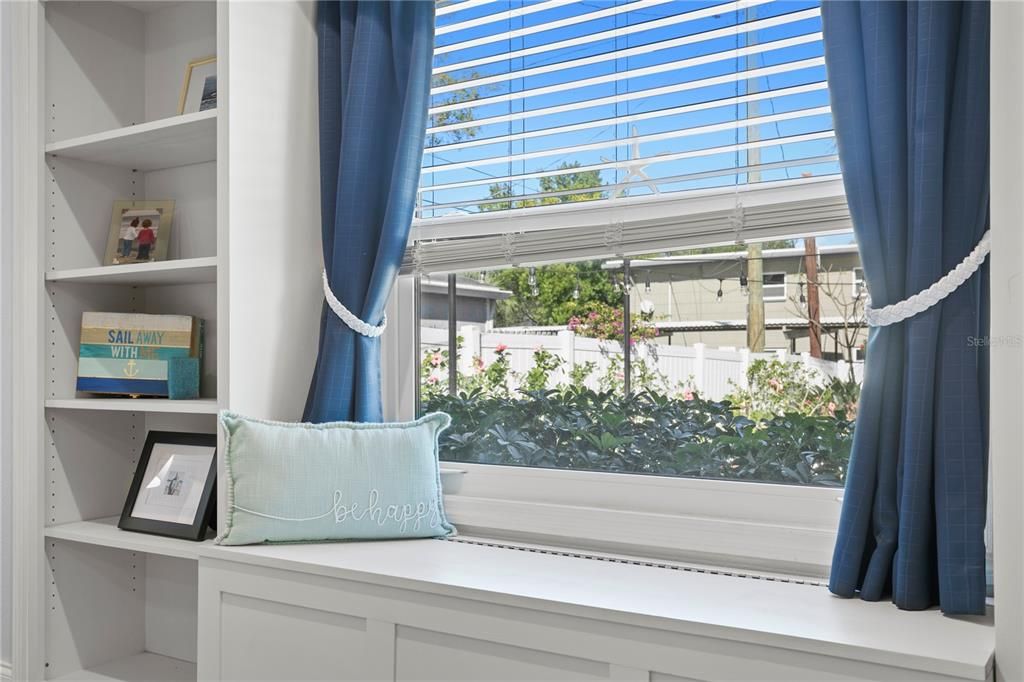 Custom cabinetry with large impact window