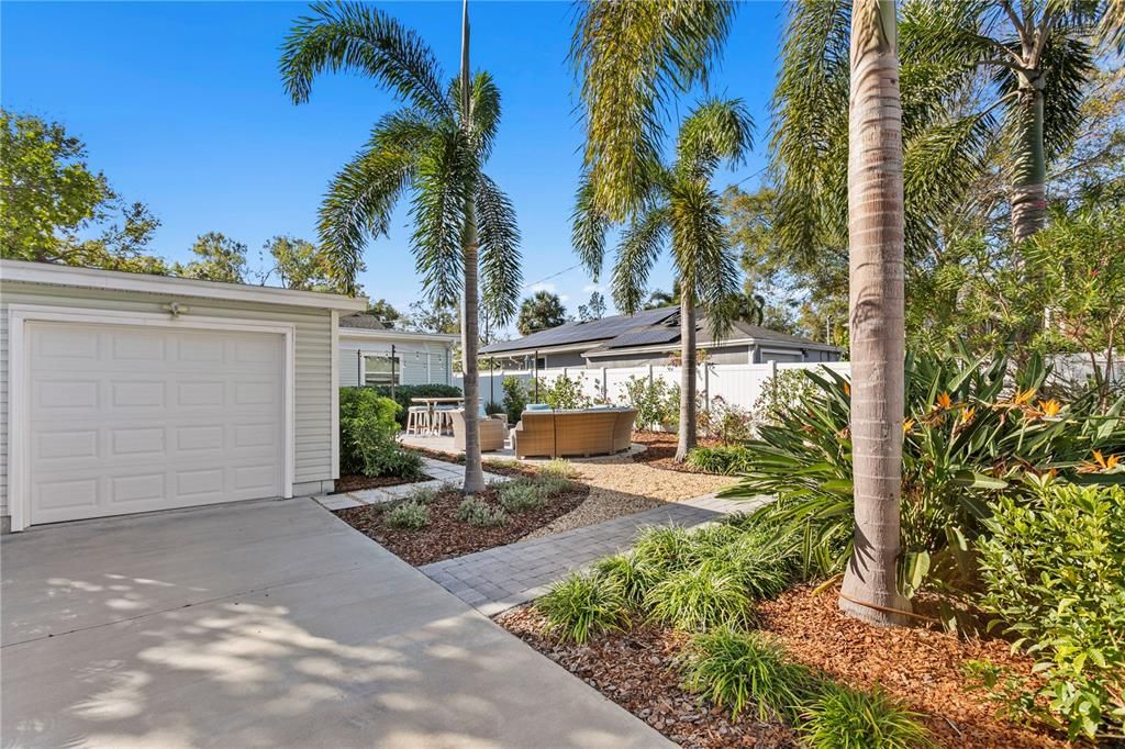 Rear driveway with alley access and motorized gate