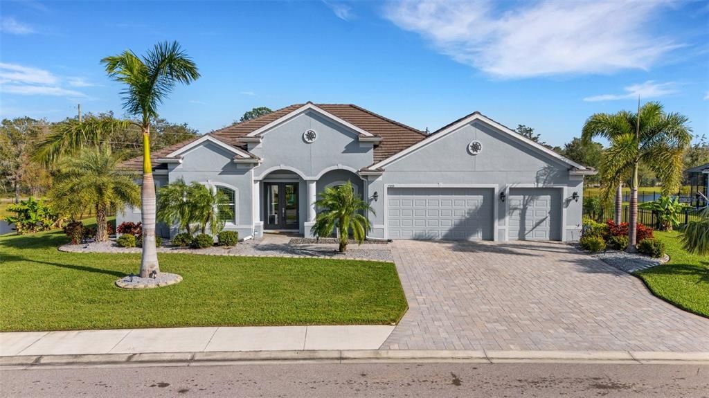 3 car garage with updated rock landscaping and trim